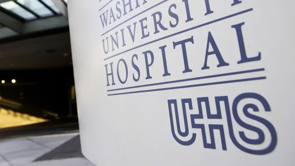 The sign in front of George Washington University Hospital, beside UHS' logo