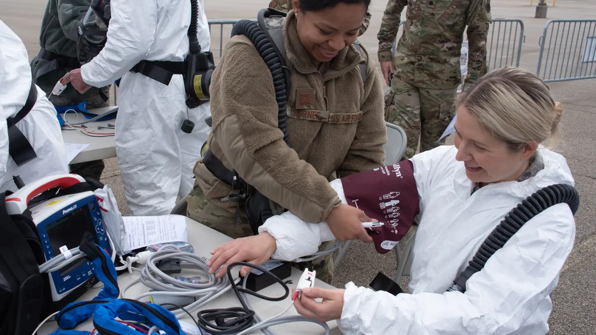 Pennsylvania Guard Members test medical equipment before Montgomery County residents arrive at a a coronavirus testing site in Upper Dublin Township