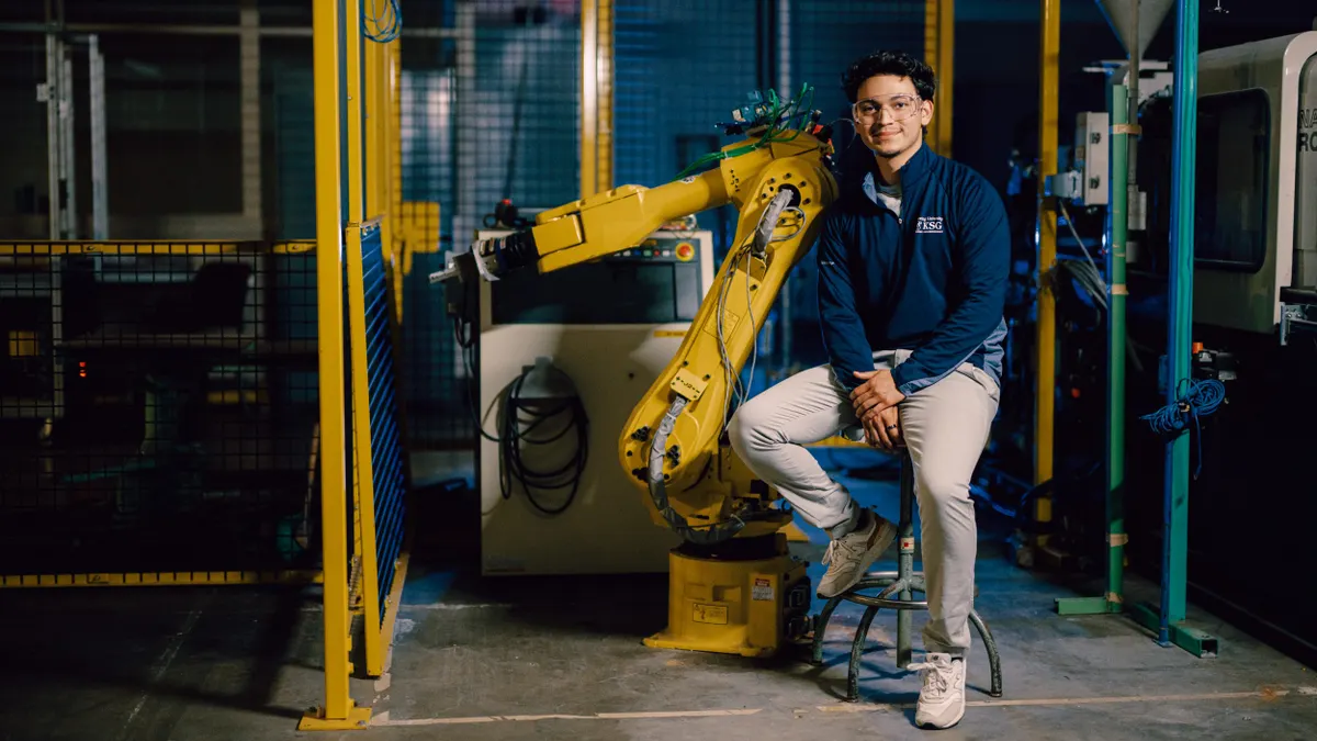 Kettering student sitting in manufacturing room