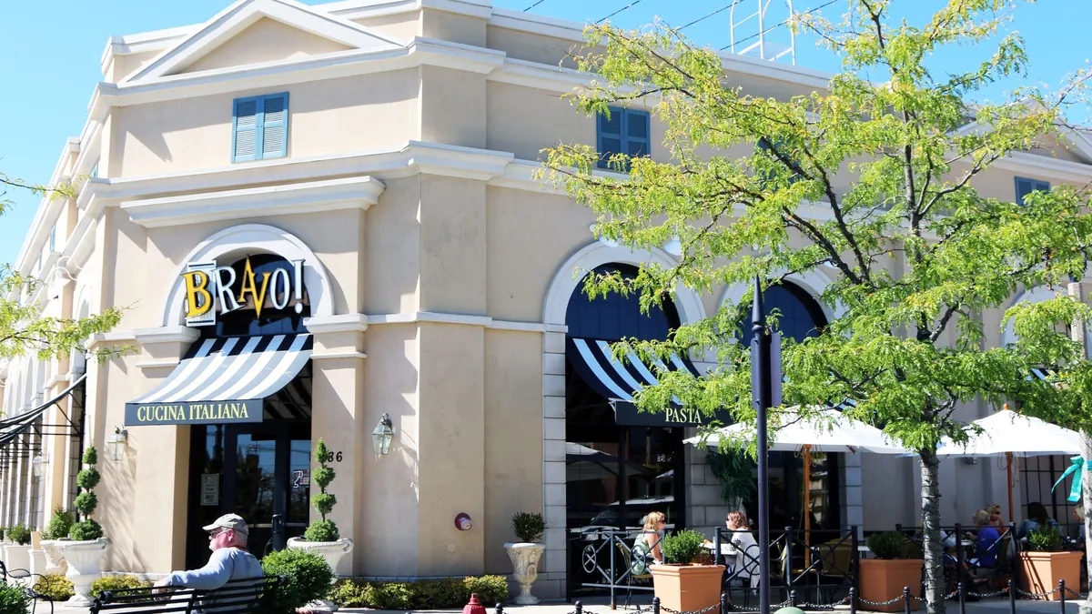 A beige building with Barvo! Cucina Italiana logo