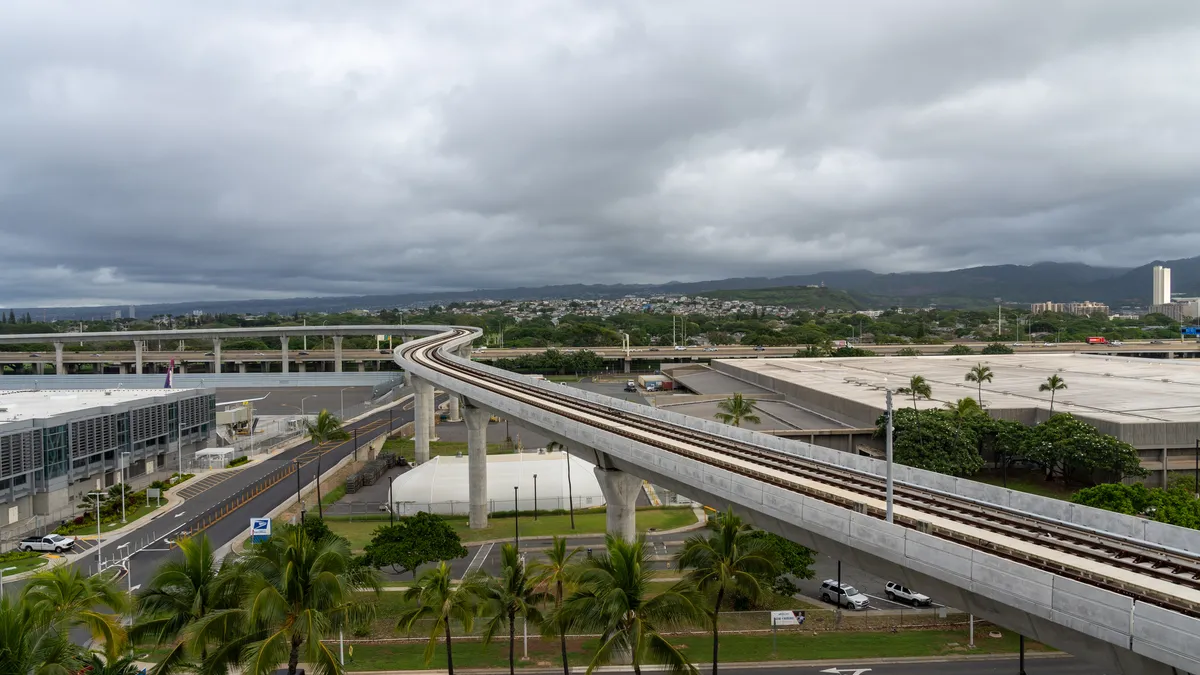 A monorail heads outward from the airport.