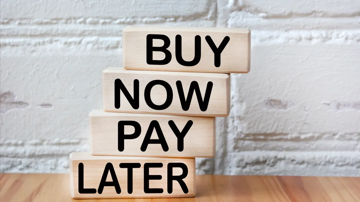 Blocks show the words "buy now pay later"