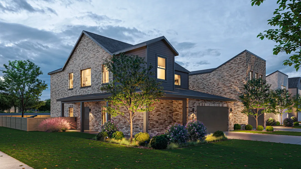 A home with a dark brick exterior.