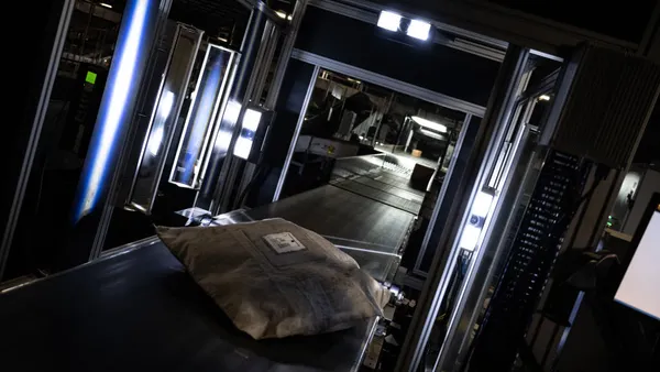 A system scans package labels before routing them to their correct chute in the UPS Centennial Ground Hub on Dec. 6, 2021 in Louisville, Kentucky.
