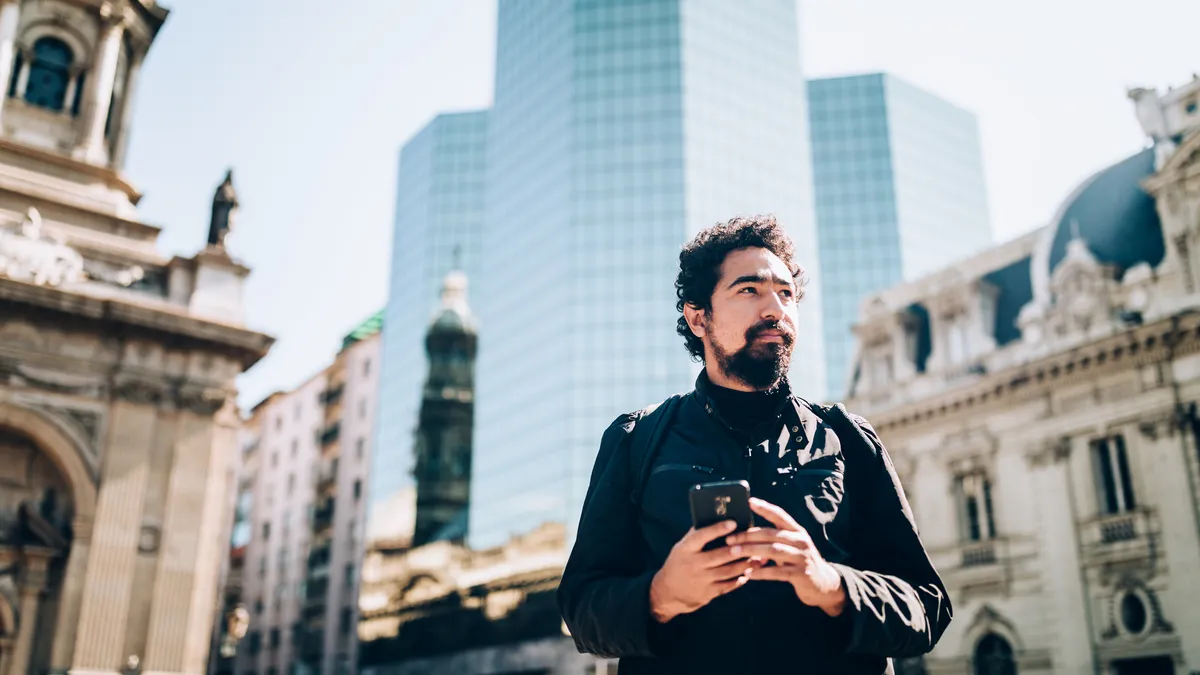 Man using cell phone at Santiago de Chile stock photo