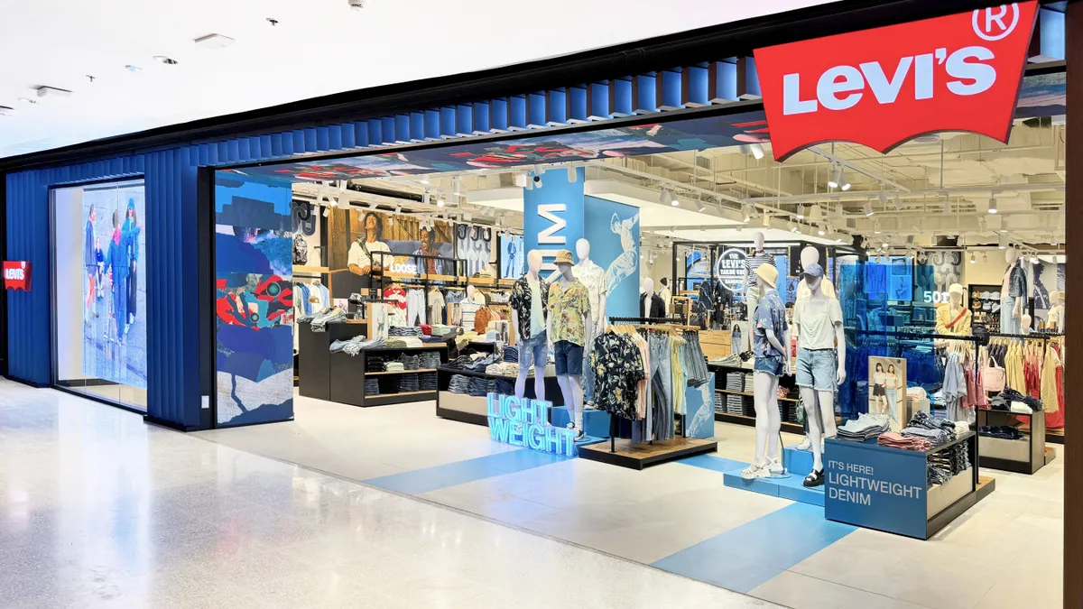 A Levi's storefront with signage touting lightweight denim.