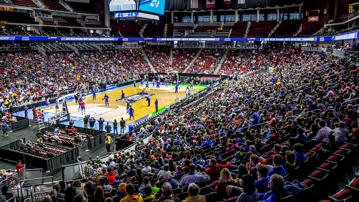 Fans watch NCAA March Madness basketball players