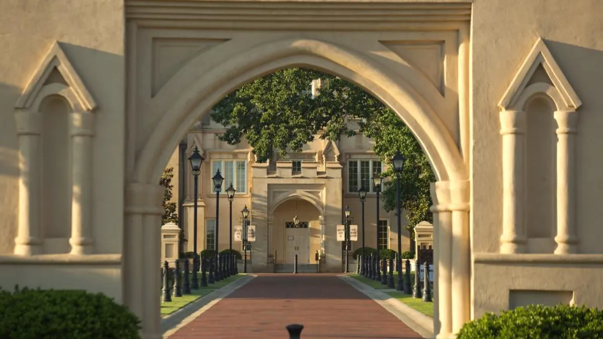 A view of a Georgia Military College entrance through an archway.