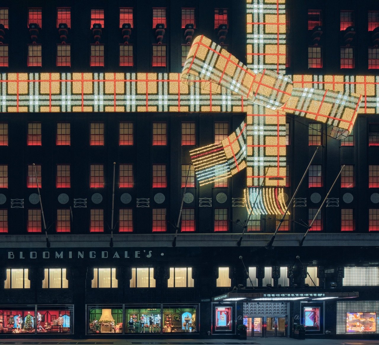 A building exterior decorated with a huge Burberry bow.