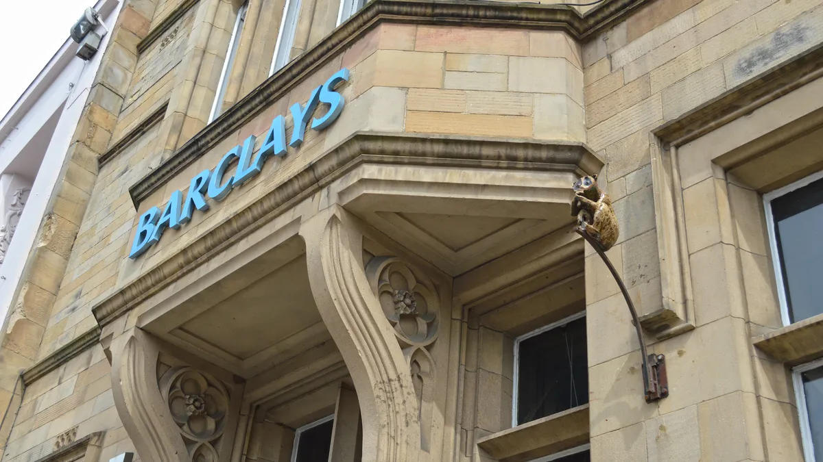 Front of building with a sign that says "Barclays."