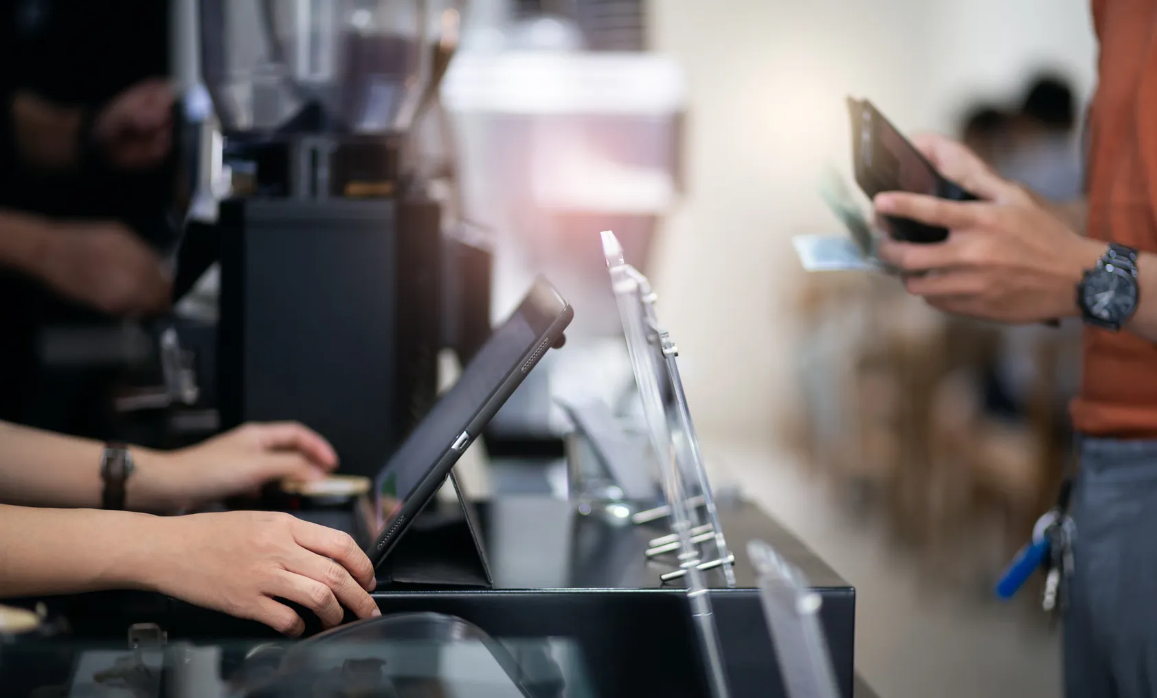 A person pays in a restaurant