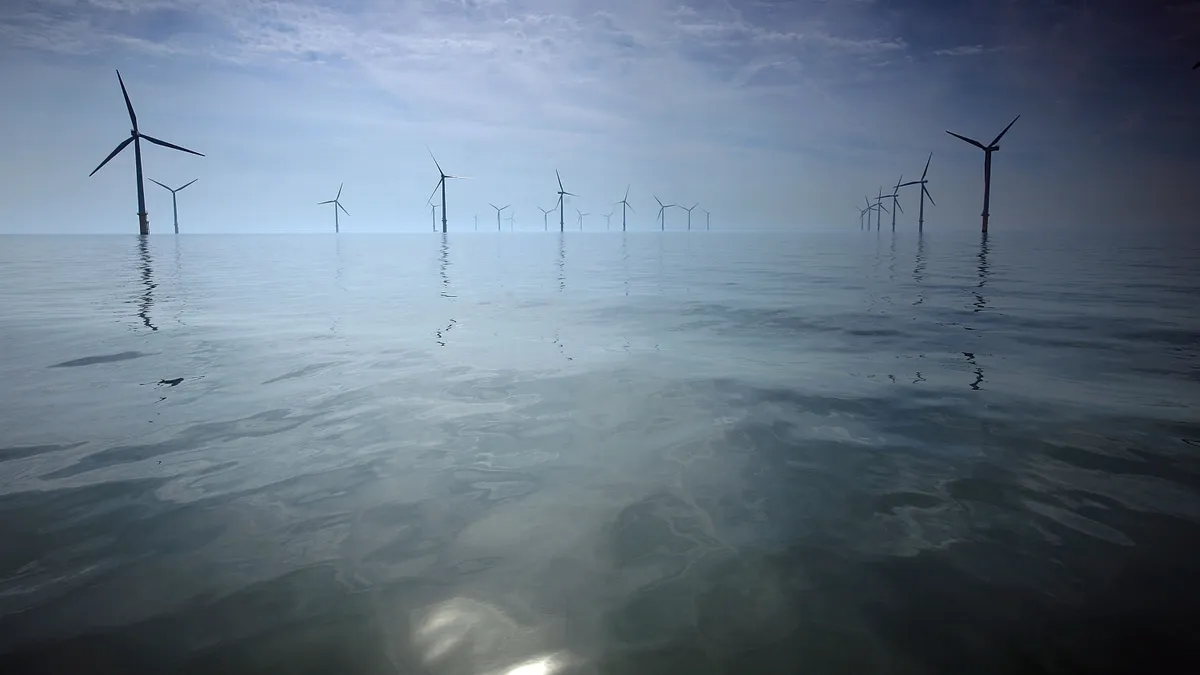 Offshore wind turbines in the ocean.