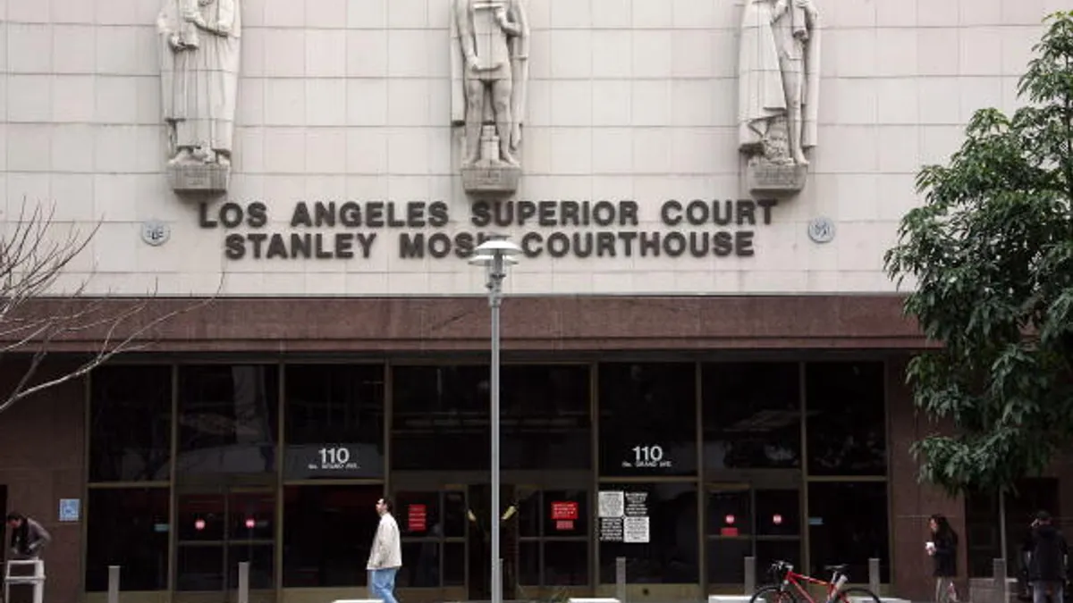 A person walks by a courthouse