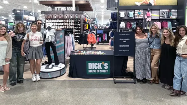 A group of people in Dick's Sporting Goods in support of the new Abercrombie Kids wholesale partnership.