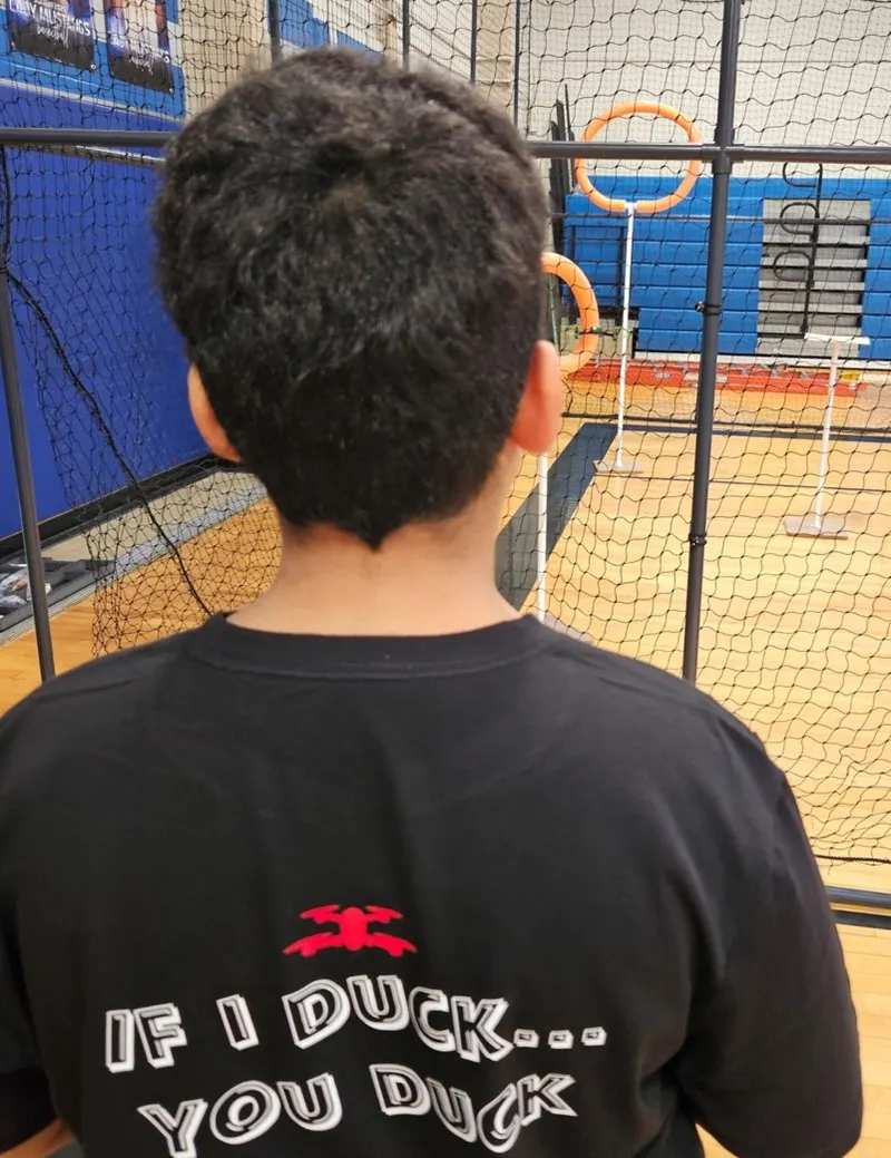 Back of student&#x27;s head looking at STEM drone project.