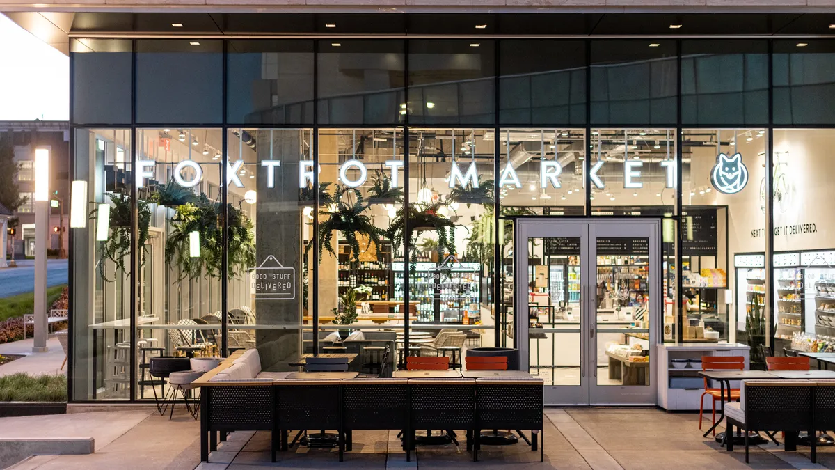 A photo of seating outside a Foxtrot c-store.