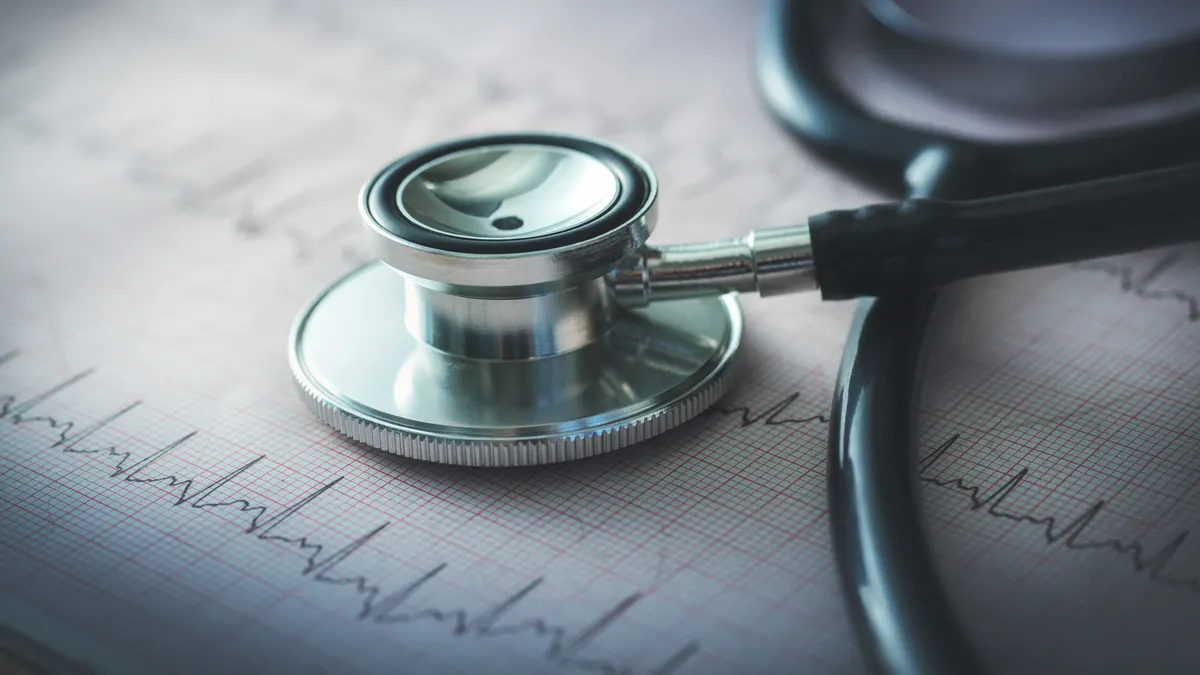 Stethoscope on top of an EKG readout