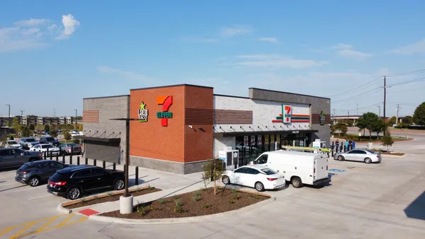 A photo of the exterior of a convenience store. Signs on the exterior of the store read "7-Eleven" and "Laredo Taco."