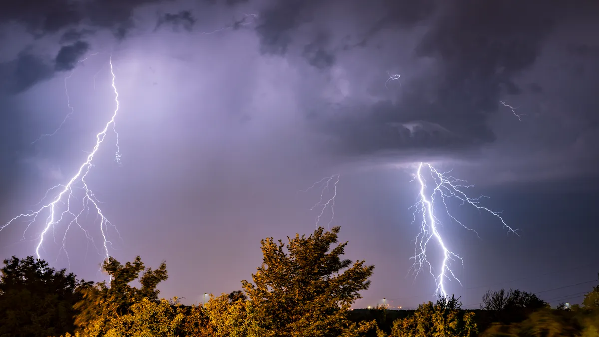 Stormy skies with 2 thunderbolts strikes in the background