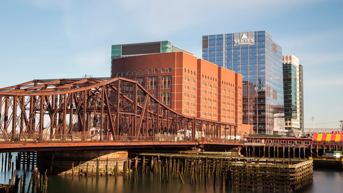 The Vertex Pharmaceuticals building in daylight on the Boston Seaport.