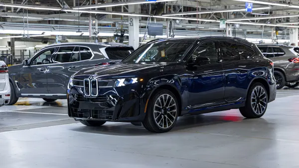 A dark-colored 2027 X5 SUV inside BMW's Plant Spartanburg.