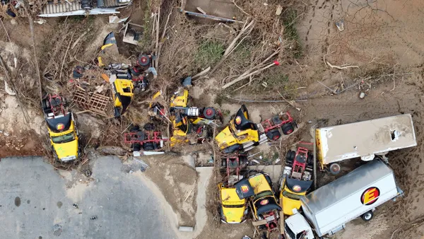 An aerial photos shows flood-damaged Estes Express Lines tractor trailers in Asheville, North Carolina, following Hurricane Helene on Oct. 4.