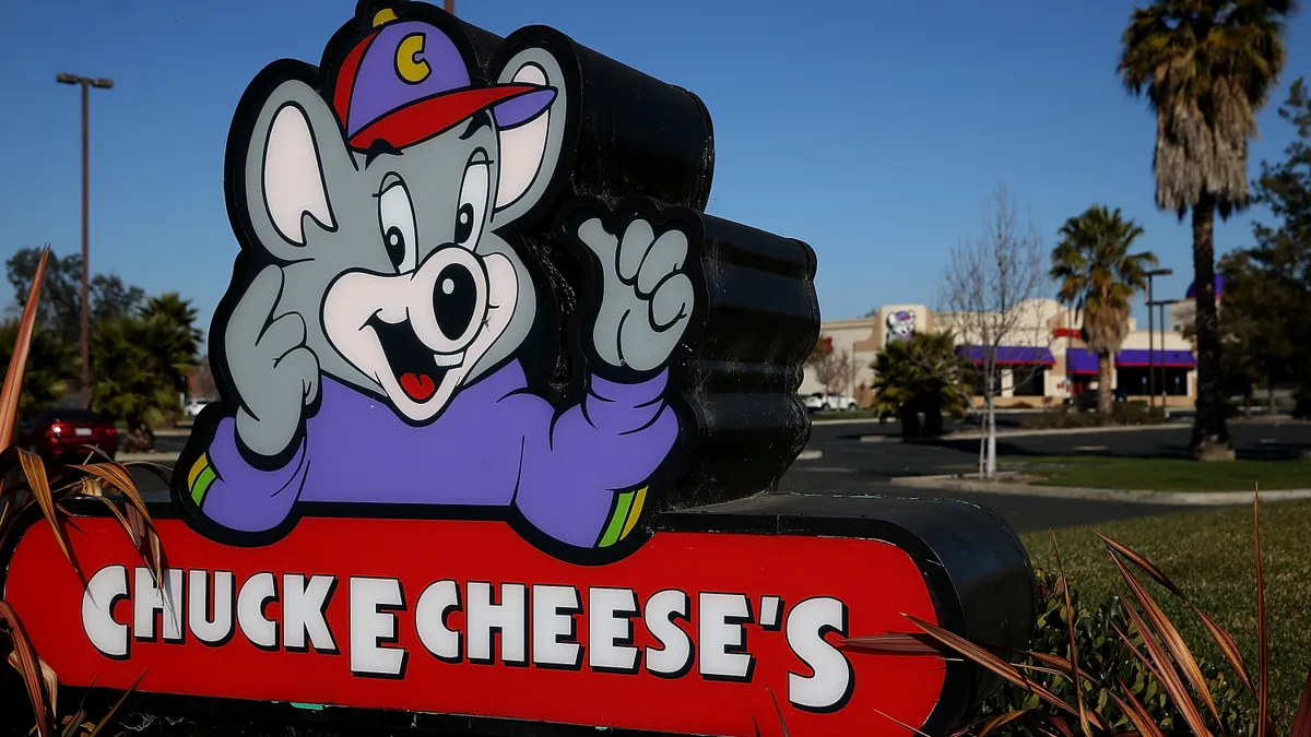 A Chuck E. Cheese sign.