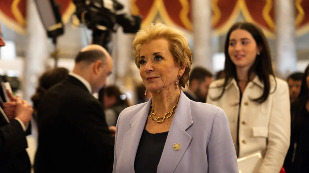 A close-up short of Linda McMahon in a crowded room.