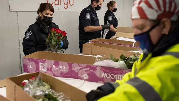 U.S. Customs and Border Protection agriculture specialists inspect flowers at Miami International Airport on Feb. 8, 2022.