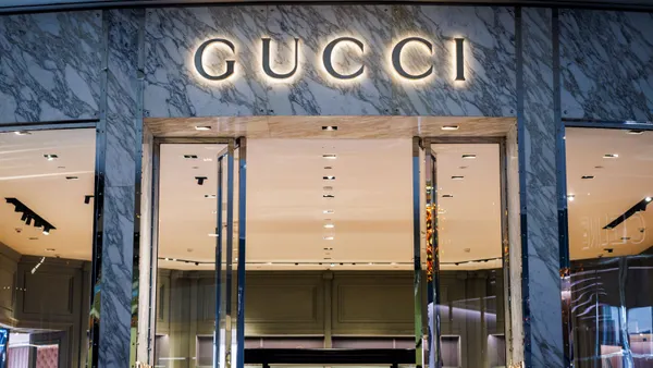 The exterior of Gucci store shows the brand's logo.
