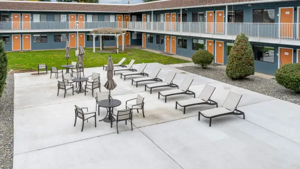 Picture of exterior hotel corridors and a pool