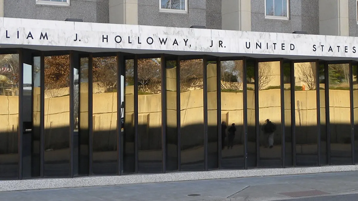 The facade of a court building with reflective glass