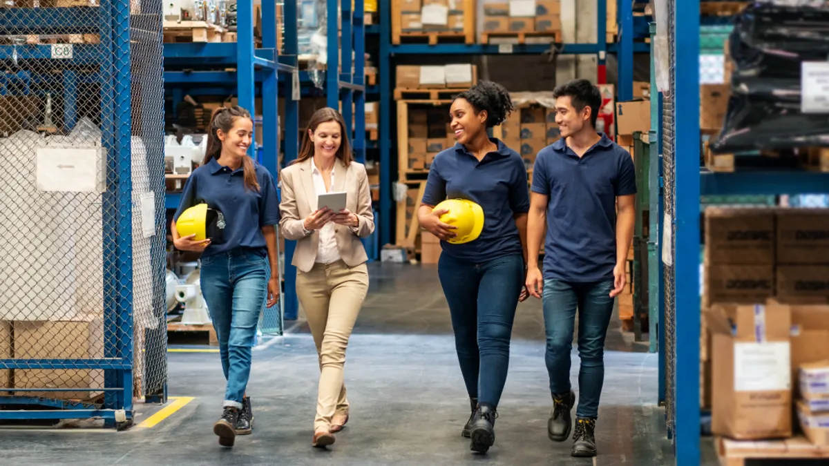 Distribution warehouse employees walking in plant stock photo