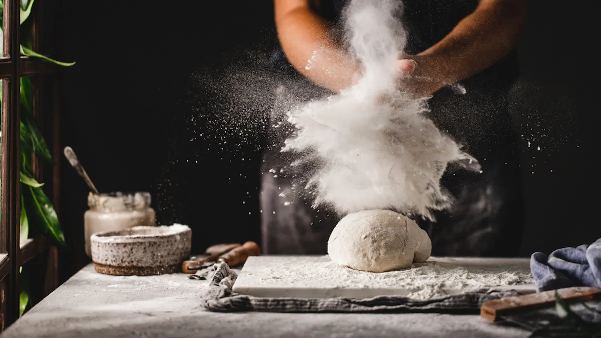 Flour cloud as individual makes dough