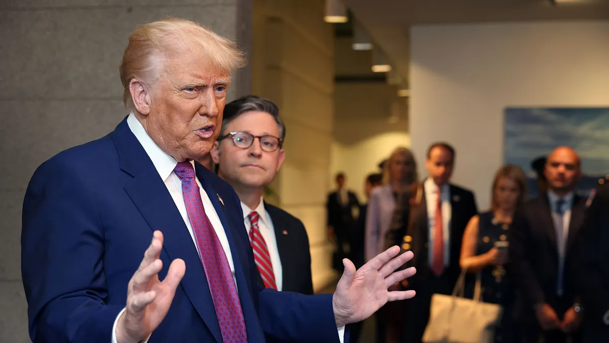 President Donald Trump speaks to reporters with Speaker of the House Mike Johnson.