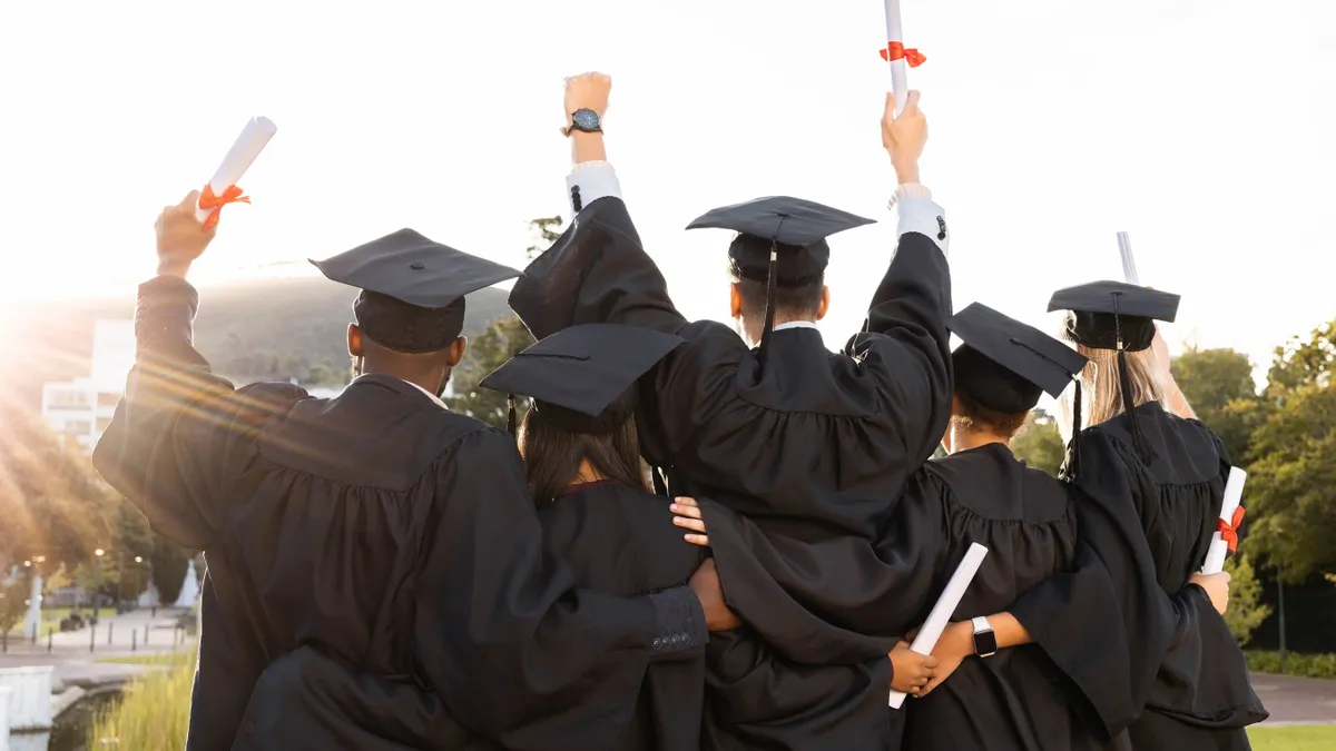 Graduation, group and back view of students celebrate education success.