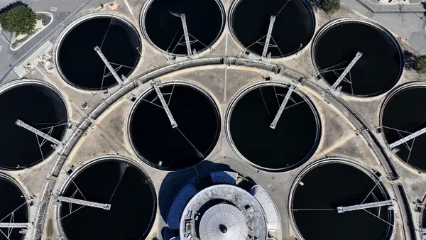 An aerial view shows large pools of water at a wastewater treatment plant
