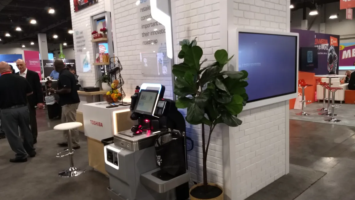 Self-checkout terminal in Grocerudhop exhibit hall