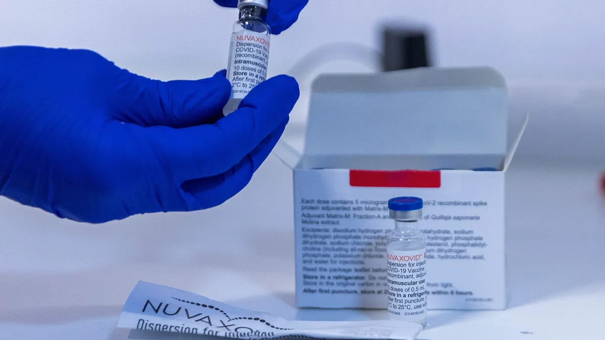 A worker prepares ampoules of the Nuvaxovid vaccine against Covid-19 by Novavax in Berlin, Germany in February 2022.