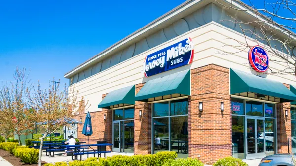 A photograph of a corner restuarant with Jersey Mike's Subs as signage.