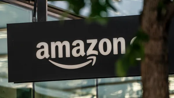 A sign is seen outside of an Amazon Go store at the Amazon.com Inc. headquarters on May 20, 2021 in Seattle, Washington.