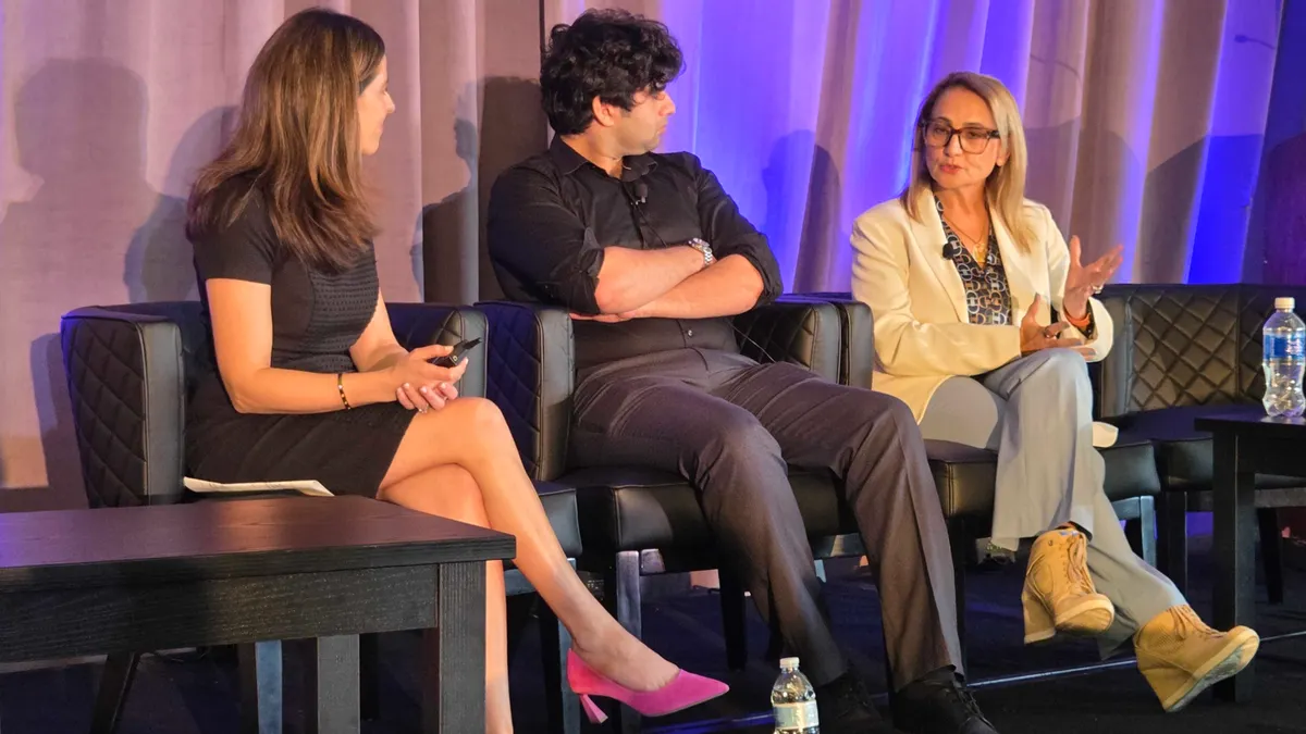 three panelists in business attire