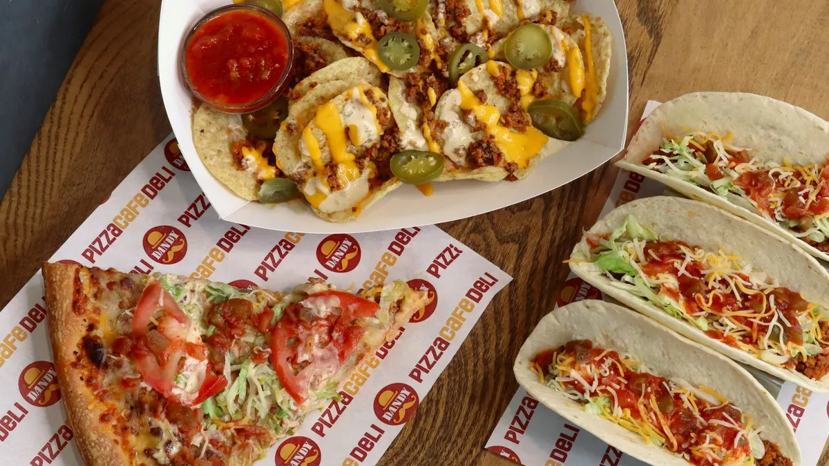 A photo of tacos, loaded nachos and taco pizza from Dandy's.