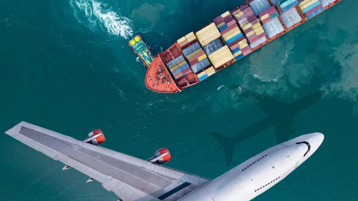 Aerial view/The plane flew past a cargo ship that was leaving the harbor, with a truckboat spinning a large ship.