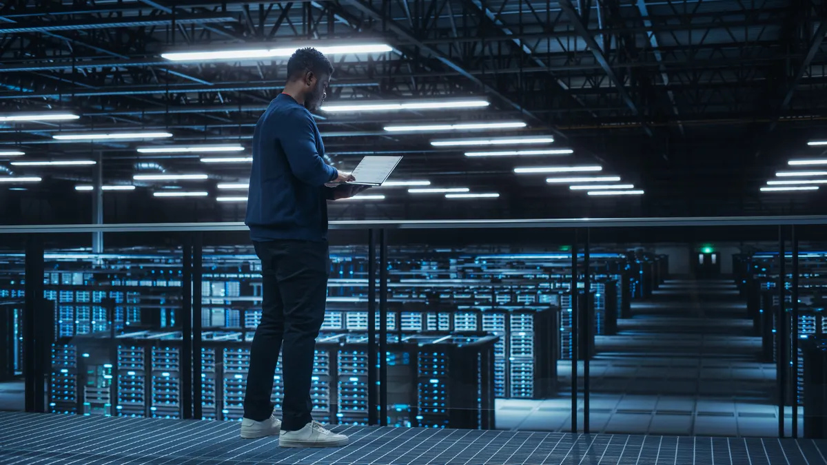 a tech worker in a large server room