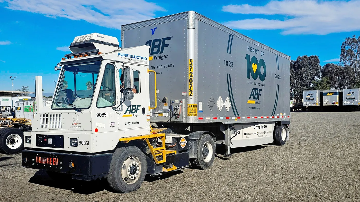 A freight trucks inside parked inside a terminal.