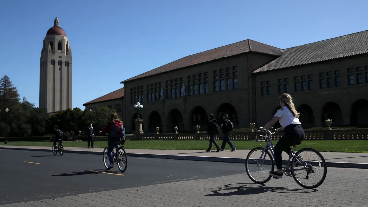 People ride bikes on Stanford University's campus