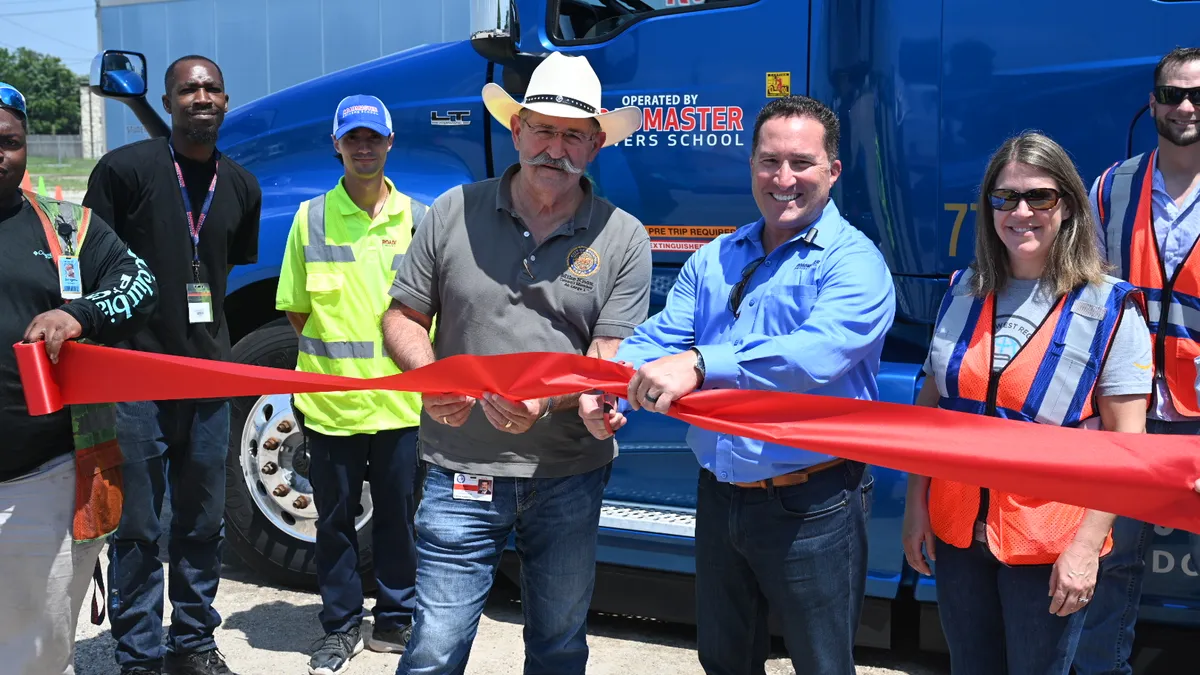 Roadmaster Drivers School President Brad Ball and Houston City Council Member At-Large Mike Knox cut a ribbon at the company's new facility in the city.