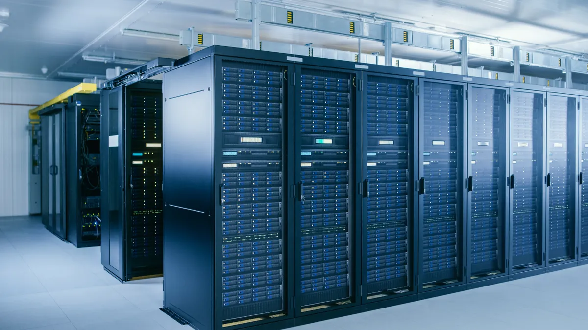 Cloud server room pictured with racks of cloud computing servers.