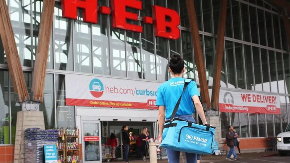 A Favor delivery person outside an H-E-B store